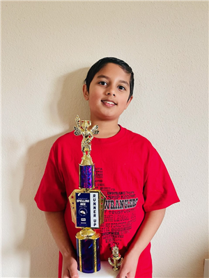 Boy holding trophy